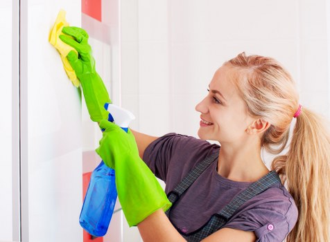 Cleaning team separating recyclable waste in a London flat