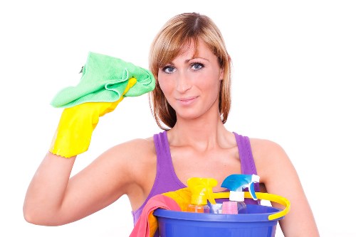 Cleaners working in a London flat with careful attention to detail