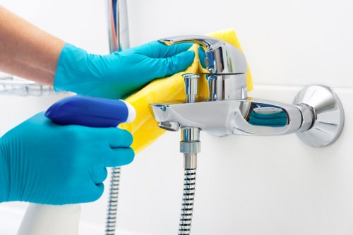 Cleaner preparing a kitchen for domestic cleaning in London