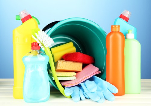 Professional cleaner working in a modern apartment kitchen